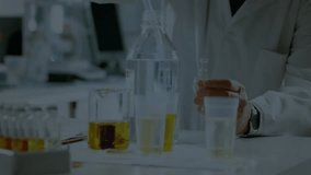 Scientist responding to pulsing DNA helix drawing solution into vial from beaker showing genetics. Genetics, biotechnology, laboratory, research, innovation, science, precision - Powered by Shutterstock - Get 15% off with code: PIKWIZARD15