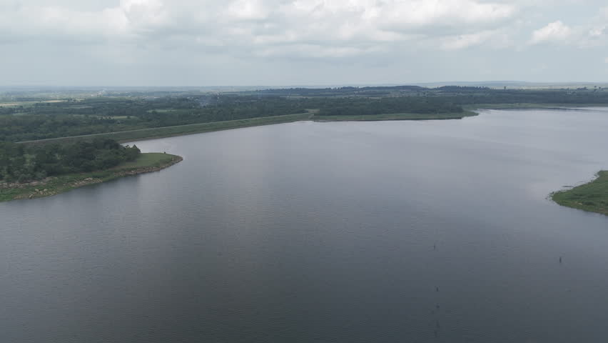 Drone footage aerial view scenic landscape of the large river and forest in dry season