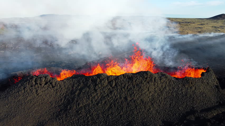 Volcano Eruption, Flowing Red Hot Lava Erupts from Crater, Incredible Natural Phenomena, Spectacular Dramatic Scenery in Iceland
