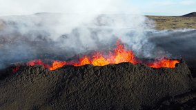 Volcano Eruption, Flowing Red Hot Lava Erupts from Crater, Incredible Natural Phenomena, Spectacular Dramatic Scenery in Iceland - Powered by Shutterstock - Get 15% off with code: PIKWIZARD15