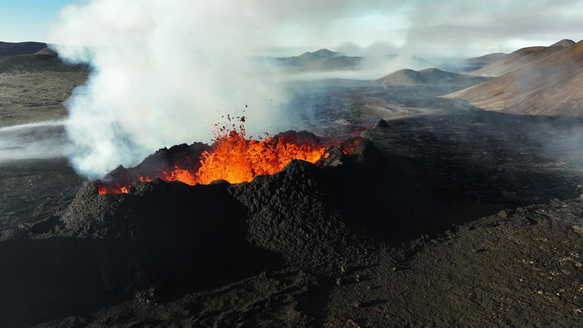 Volcano Eruption, Flowing Red Hot Lava Erupts from Crater, Incredible Natural Phenomena, Spectacular Dramatic Scenery in Iceland