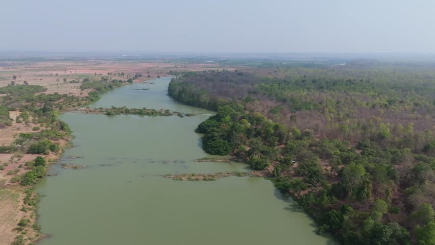 Breathtaking view of Buon Don river surrounded by lush greenery and peaceful landscape in Dak Lak, Vietnam during daytime