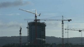 Site opening showing high-rise tower, code fading, scrolling, mixing digital, construction visuals. Architecture, engineering, technology, urban, industrial, innovation, programming - Powered by Shutterstock - Get 15% off with code: PIKWIZARD15