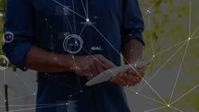 Man tapping tablet screen and scrolling through animated data charts for outdoor analytics demo. Technology, data visualization, innovation, professional, outdoor, analytics, modern - Powered by Shutterstock - Get 15% off with code: PIKWIZARD15