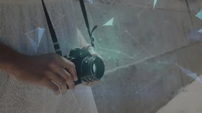 Photographer adjusting focus ring pressing button generating polygons forming digital globe. Futuristic, technology, innovation, digital, hologram, urban, creative - Powered by Shutterstock - Get 15% off with code: PIKWIZARD15