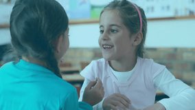 Helper tucking headband, hugging classmate while digital shield floating and wearer raising hands. Friendship, cybersecurity, data protection, school, collaboration, digital security, teamwork - Powered by Shutterstock - Get 15% off with code: PIKWIZARD15