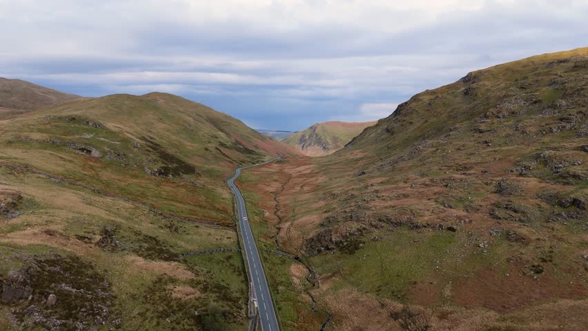 A470 Bwlch y Groes mountain pass route in Snowdonia, Wales near Dinas Mawddwy featuring rugged hills and remote landscape. 4K drone video.