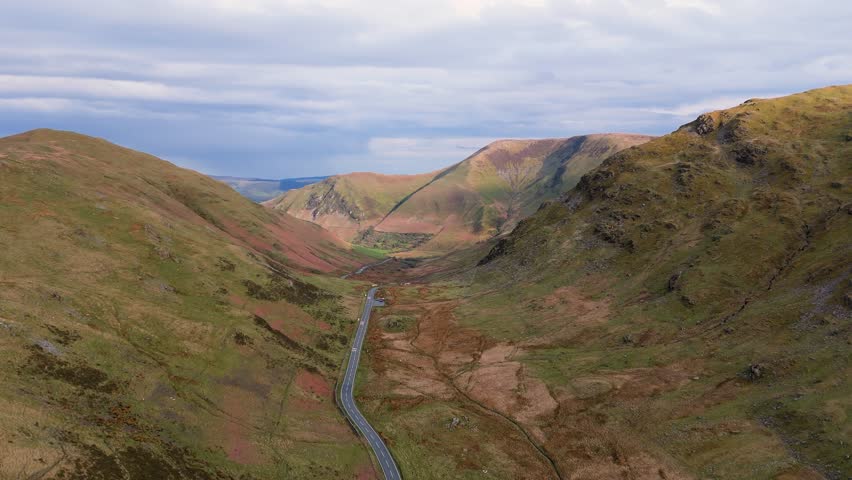 A470 Bwlch y Groes mountain pass route in Snowdonia, Wales near Dinas Mawddwy featuring rugged hills and remote landscape. 4K drone video.