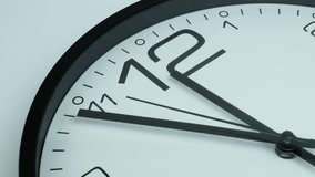 A close-up of a clock just before noon on a white background - Powered by Shutterstock - Get 15% off with code: PIKWIZARD15