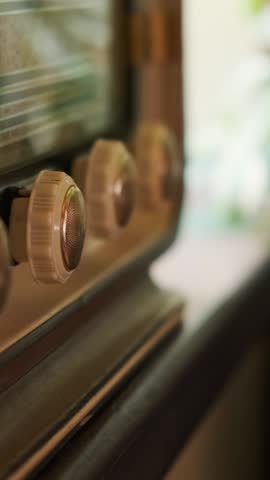 Woman Tunes Old Radio At Home