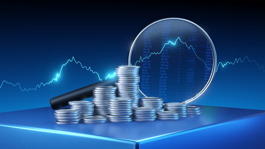 Financial graph and data seen through a magnifying glass with silver coins. Concept of business success and investment growth.