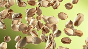 Super Slow Motion Shot of Fresh Pistachio Nuts Flying Up on Green Background at 1000fps. - Powered by Shutterstock - Get 15% off with code: PIKWIZARD15