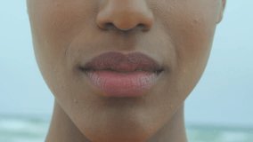 Lower face showing social media metrics networking around padlock securing data dissolving smiling. Digital, connectivity, security, emotion, technology, social, network - Powered by Shutterstock - Get 15% off with code: PIKWIZARD15