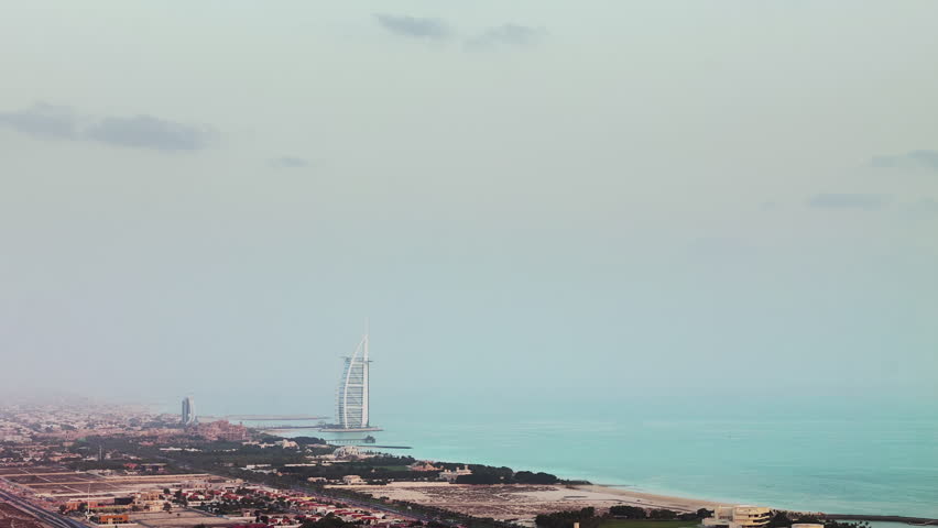 DUBAI, UNITED ARAB EMIRATES - October 10, 2018: sunset twilight world famous bay hotel burj al arab rooftop panorama 4k timelapse