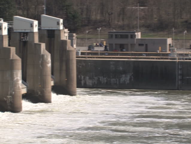 A slow pan of a lock and dam on the Ohio River.