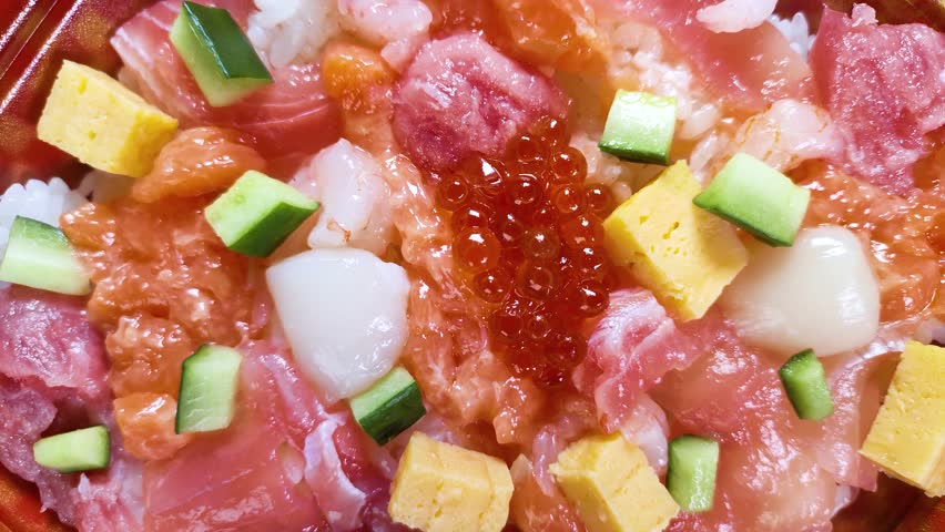 Japanese cuisine Seafood Chirashi Sushi or Chirashizushi close up, rotating