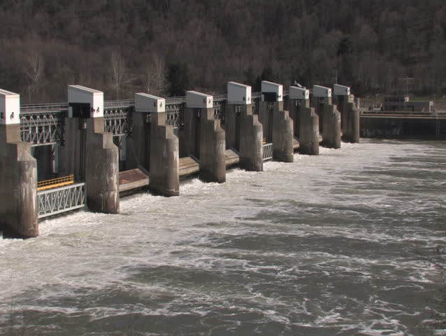A slow pan of a lock and dam on the Ohio River.