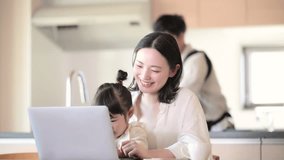 Mom working in her living room and dad doing housework Remote work, image vertical video of co-workers and househusbands	 - Powered by Shutterstock - Get 15% off with code: PIKWIZARD15