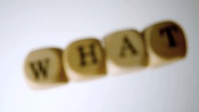 What spelled out in dice falling and bouncing on white surface in slow motion - Powered by Shutterstock - Get 15% off with code: PIKWIZARD15