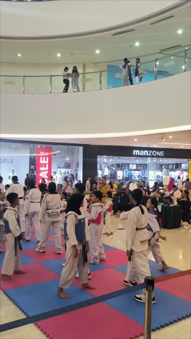 Jakarta, Indonesia - June 1, 2025: A bustling indoor scene showing a Taekwondo event or practice for children and teenager in Mall