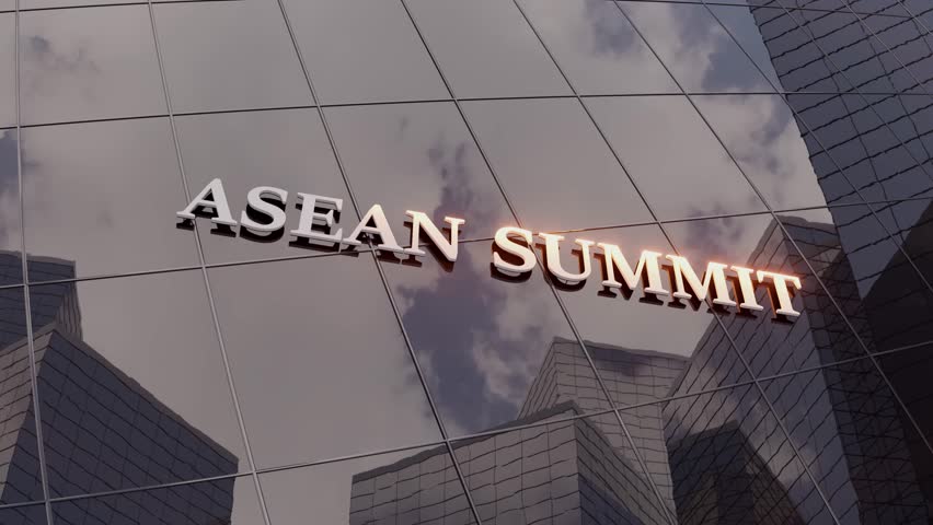 Reflective glass building displays Asean Summit sign with clouds mirrored on its surface, animation.
