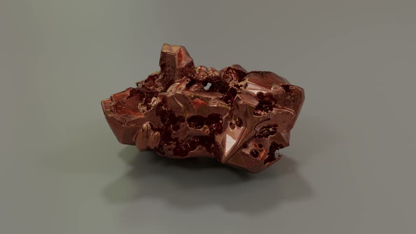 Shiny, rough copper piece on simple gray backdrop
