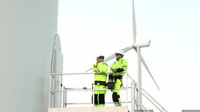 Engineer Inspecting Wind Turbine at Construction Site, Wearing Safety Gear and Monitoring Progress, Ideal for Renewable Energy and Green Technology Themes - Powered by Shutterstock - Get 15% off with code: PIKWIZARD15