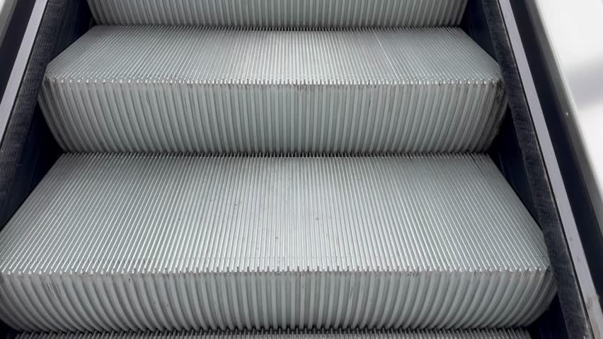 Ascending escalator movement captured in high definition urban setting