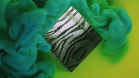 Dye liquid. Color smoke cloud. Defocused green yellow haze fume cube mist splash paint ink texture on abstract patterned art background. - Powered by Shutterstock - Get 15% off with code: PIKWIZARD15