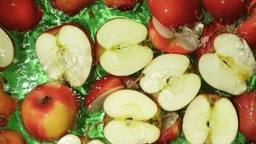 Juicy Whole and Cut Red Apples Close-Up in Water Splash Top View - Powered by Shutterstock - Get 15% off with code: PIKWIZARD15