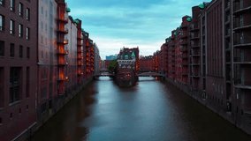 Aerial drone sunset view of bridge, canal and houses the Speicherstadt, Hamburg, Germany, May 19, 2025. High quality 4k footage - Powered by Shutterstock - Get 15% off with code: PIKWIZARD15
