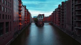Aerial drone sunset view of bridge, canal and houses the Speicherstadt, Hamburg, Germany, May 19, 2025. High quality 4k footage - Powered by Shutterstock - Get 15% off with code: PIKWIZARD15