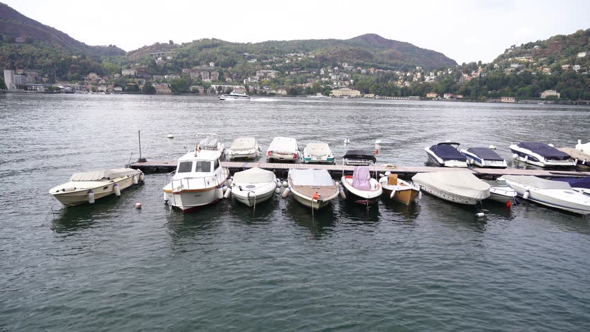 Docked Boats on the Serene Lake Shore A Tranquil Scene of Relaxation and Adventure Awaits