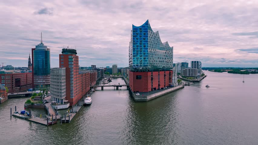 Aerial drone view of the Elbphilharmonie, ships and cityscape riverfront of Hamburg, Germany May 19, 2025. High quality 4k footage