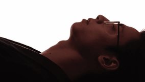 Vertical video. Smart silhouette. Leader face. Dark contrast profile outline of confident pensive business man in eyeglasses isolated on white. - Powered by Shutterstock - Get 15% off with code: PIKWIZARD15