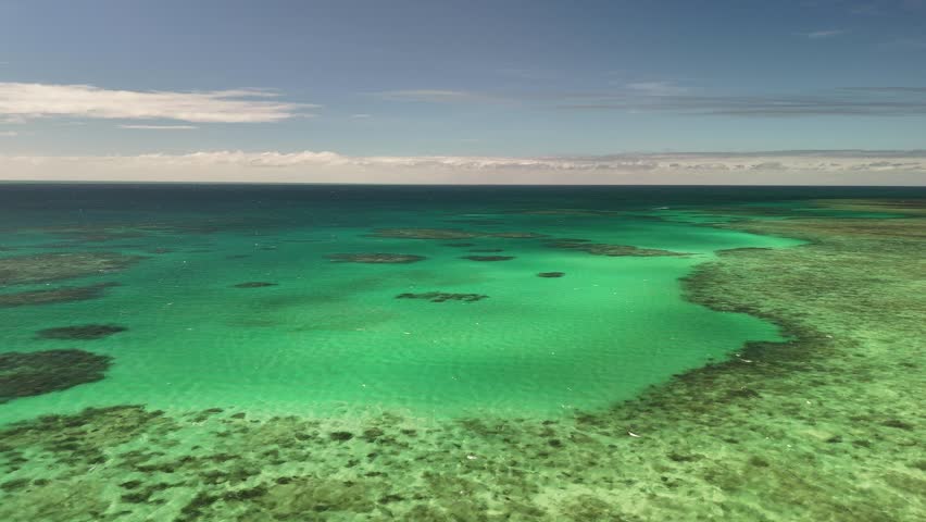 Green Island, Cairns, Queensland, Australia – 4K Aerial Drone Footage of Coral Cay on the Great Barrier Reef, Featuring Turquoise Waters, Coastal Reef, Jetty, White Sand Beaches, and Lush Rainforest 