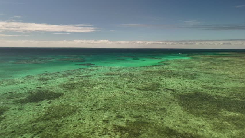 Green Island, Cairns, Queensland, Australia – 4K Aerial Drone Footage of Coral Cay on the Great Barrier Reef, Featuring Turquoise Waters, Coastal Reef, Jetty, White Sand Beaches, and Lush Rainforest 