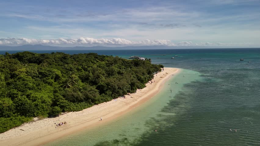 Green Island, Cairns, Queensland, Australia – 4K Aerial Drone Footage of Coral Cay on the Great Barrier Reef, Featuring Turquoise Waters, Coastal Reef, Jetty, White Sand Beaches, and Lush Rainforest 
