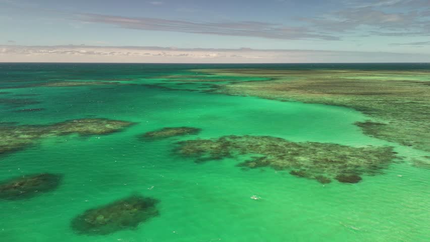 Green Island, Cairns, Queensland, Australia – 4K Aerial Drone Footage of Coral Cay on the Great Barrier Reef, Featuring Turquoise Waters, Coastal Reef, Jetty, White Sand Beaches, and Lush Rainforest 