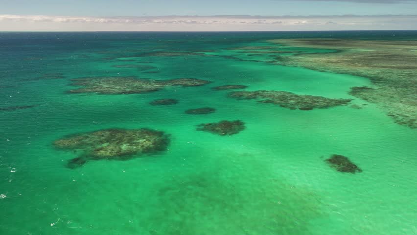 Green Island, Cairns, Queensland, Australia – 4K Aerial Drone Footage of Coral Cay on the Great Barrier Reef, Featuring Turquoise Waters, Coastal Reef, Jetty, White Sand Beaches, and Lush Rainforest 