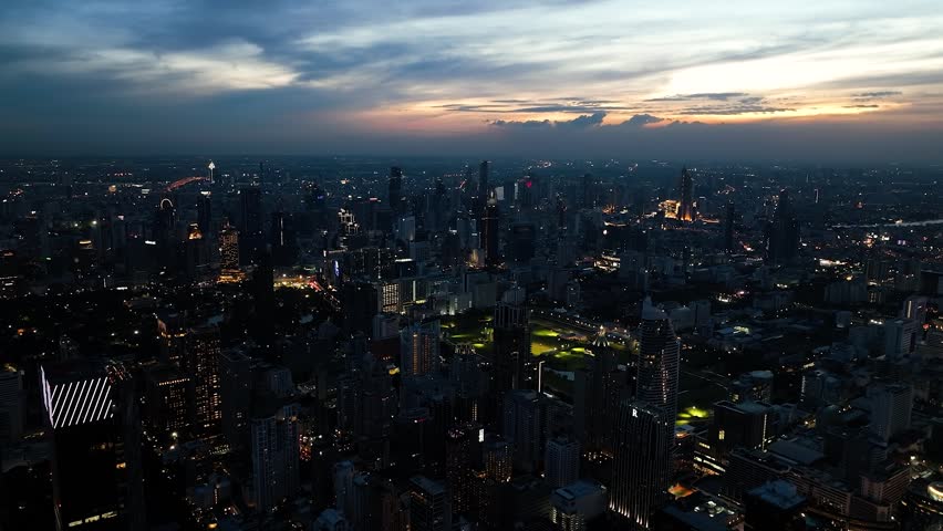 Urban landscape with night lights marking every street and alley. Bangkok, Thailand.