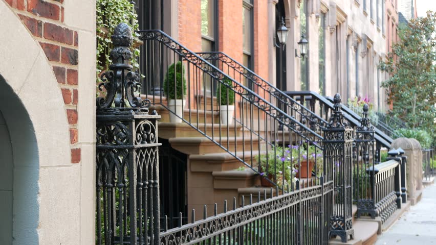 New York City townhouse building, Brooklyn Heights residential district, USA. Brownstone urban architecture, attached house. United States real estate, american property, apartments and homes in NYC.
