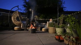 Smokey garden firepit, family evening social gathering, patio plants - Powered by Shutterstock - Get 15% off with code: PIKWIZARD15