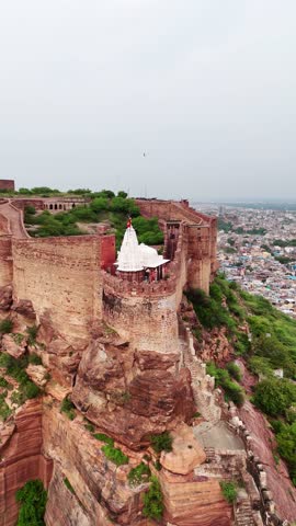 Vertical drone orbit showing fort walls, tempe and city in backdrop