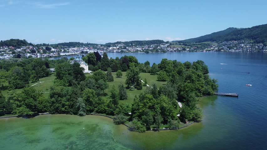 Toskana Park and castle Ort Seeschloss Ort in Gmunden at lake Traunsee in Upper Austria, aerial video