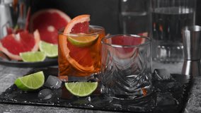 Grapefruit Aperol Spritz. This gin based cocktail is full of citrus flavors and will be your go to fizzy drink. Horizontal video. Real time - Powered by Shutterstock - Get 15% off with code: PIKWIZARD15
