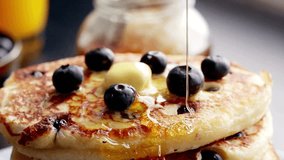 Stack of Pancakes with Melting Butter. adds maple syrup to pancakes in kitchen. Close up video of butter melting on a stack of delicious pancakes. - Powered by Shutterstock - Get 15% off with code: PIKWIZARD15