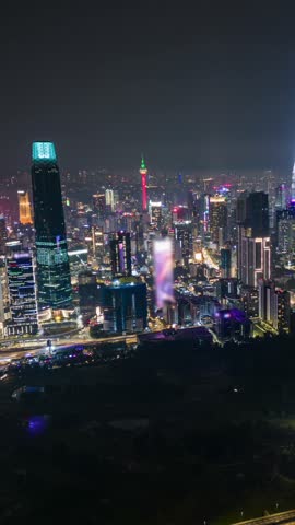 Aerial timelapse of Kuala Lumpur skyline at night with glowing skyscrapers, city lights, and traffic in motion. Ideal for urban, travel, and architecture themes.
