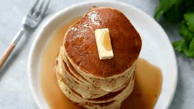 Stack of Pancakes with Melting Butter. adds maple syrup to pancakes in kitchen. Close up video of butter melting on a stack of delicious pancakes. - Powered by Shutterstock - Get 15% off with code: PIKWIZARD15