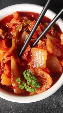 Kimchi pickled cabbage salad spicy savory vegetables fresh delicious gourmet food background on the table rustic food top view copy space vegetarian and vegan food